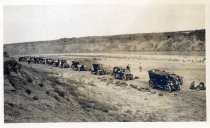 Procession of automobiles through desert