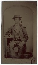 Portrait of man sitting in chair