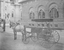 Horse-drawn cart in front of old post office