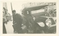 Unloading baggage from c.1910 automobile in downtown San Jose, CA