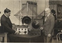 Lee de Forest and M. Levy comparing radios