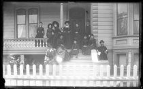 Family portrait on front steps of house