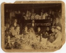 Group portrait of family at dinner table
