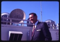 Robert Skibinski in suit in front of antennas