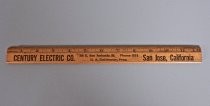 Three wood rulers from local businesses