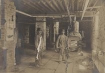 Men in basement with boiler