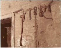 Exterior of adobe showing east wall, entrance and construction detail