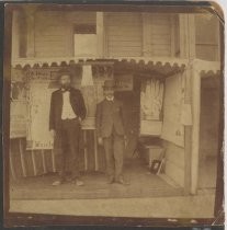 William E. Riker and unidentified man in stall