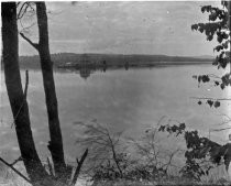 View of boathouse or gazebo across lake, c. 1912