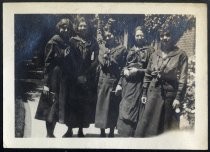 Group portrait of four women in school uniform