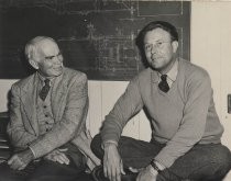 Lee de Forest on a desk with another man