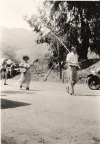 Henrietta Escobar (Bernal) playing the guitar in New Almaden parade