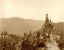 Three men on boulder overlook