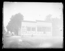 Woman in front of commercial buildings