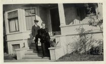 Man and woman on steps of house, No. 804