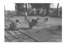 Jim Arbuckle fitting adobe tiles for Pellier Park walkway