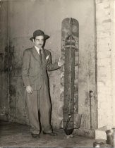 Man standing next to Lee de Forest's dirigible bomb