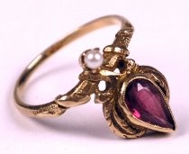 Gold ring with pink stone