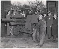 San Jose Manufacturers Association. Group of men viewing a howitzer carriage