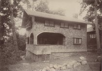 Wood-shingled residence in forest