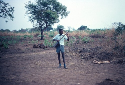 Local musician with locally made guitar, Mukupa Katandula village