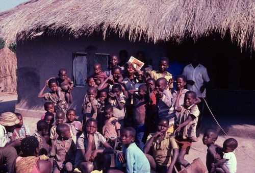 Neighbors gathering for group portrait, Nsama, Kaputa District