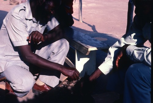 Men playing "Chilolo" game at Kaputa village