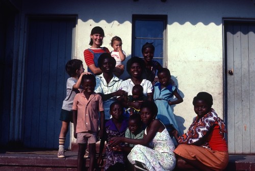 Portrait of Donna, Michael and Daniel Cancel with neighbors at Nsama village