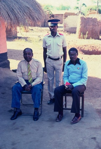 Chief Mukupa Katandula (left) with messenger and adviser