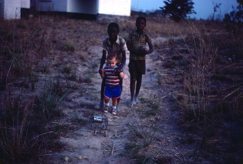 Children playing with locally-made wire car at Nsama village