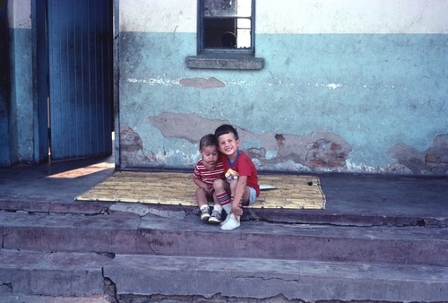 Daniel and Michael Cancel on veranda of our home at Nsama