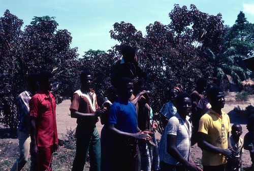 Groom being carried on the shoulders of his relatives at a wedding in Kaputa village