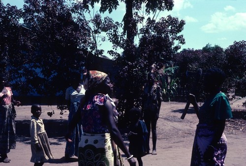 Women and children in neighborhood near river at Kaputa village