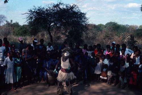 Masked Dancer and Drummers at Nsama village