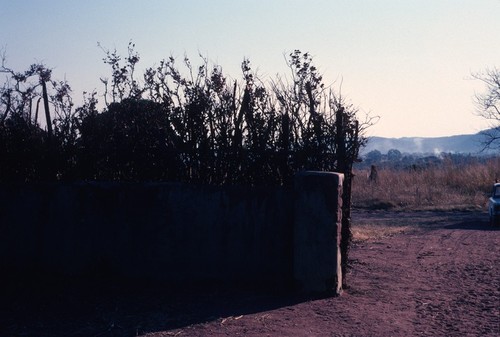 View from inside entrance gate to Chief Bwile's compound/palace, looking out towards the Democratic Republic of the Congo