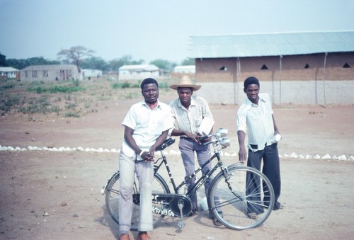 Men with bicycle near a church in Kaputa