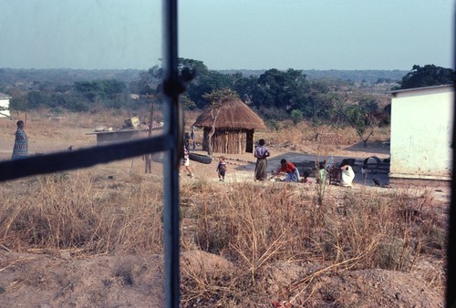 View from inside our home at Nsama village with Michael and Daniel Cancel interacting with neighbors