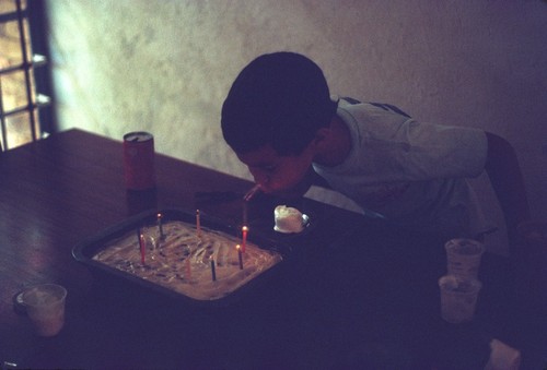 Daniel Cancel blowing out the candles during his seventh birthday party at faculty housing in Lusaka, Zambia