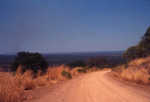 View of road and distant hills, driving north, on the way to Lake Tanganyika