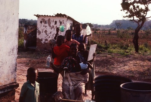 Neighbors at Nsama with a traditional "still" for making local liquor