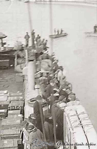 Repatriated evacuees take a last look as they leave Tientsin, March, 1946