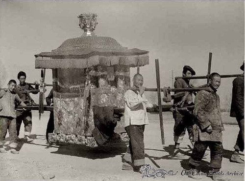 Chinese bride being carried in a palanquin to Tienstin, spring 1946