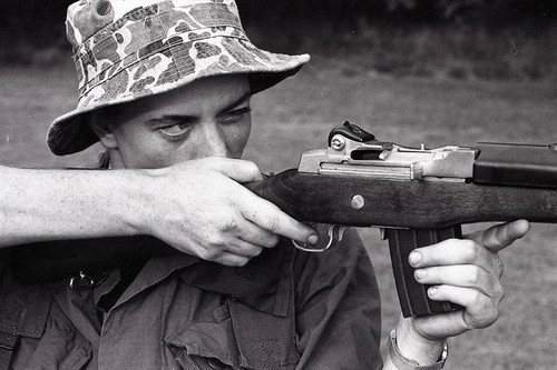 Survival school student holds a gun, Liberal, 1982