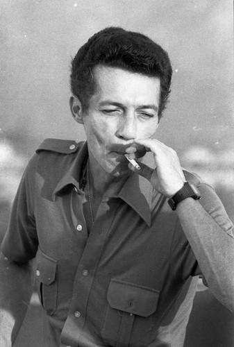 Roberto D'Aubuisson smoking a cigarette, San Salvador, 1982