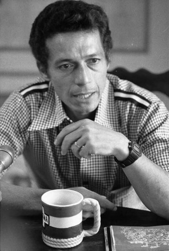 Roberto D'Aubuisson drinking coffee and speaking, San Salvador, 1982