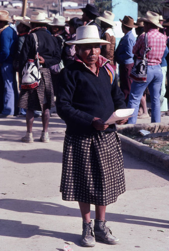 Mayan man holding his ballot on election day, Nahualá, 1982