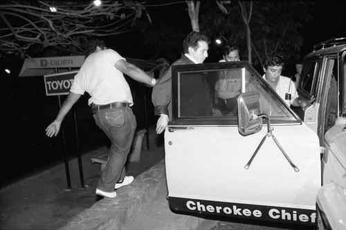 Politician entering in a SUV, San Salvador, 1982