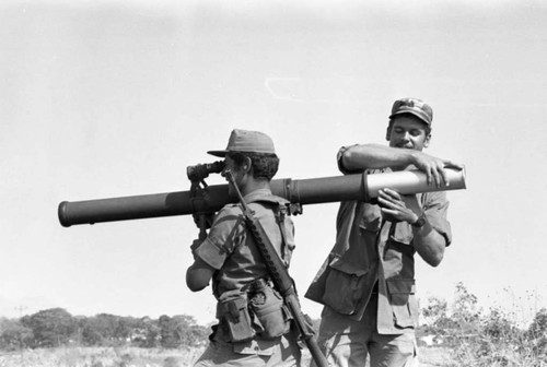 A U.S. military advisor training a Salvadoran soldier at Ilopango Military Base, Ilopango, 1983