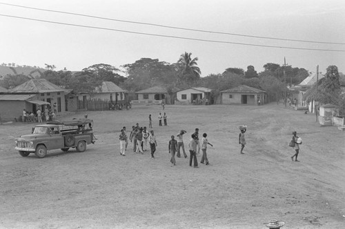 Group of men walking near a truck, San Basilio de Palenque, 1976