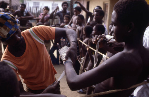 Man wrapping hands for boxing, San Basilio de Palenque, 1976